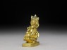 Figure of a bodhisattva seated on a bird (side)