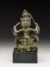 Figure of a multi-headed and multi-armed deity (side)