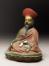 Seated figure of a philosopher, possibly Nagarjuna (side)