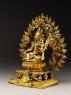 Seated figure of a female deity, possibly Tara, with a mandorla of flames (side)