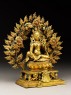 Seated figure of a female deity, possibly Tara, with a mandorla of flames (side)