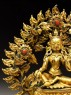 Seated figure of a female deity, possibly Tara, with a mandorla of flames (detail)