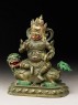 Figure of a male deity seated on a mythical animal, possibly a lion dog (side)