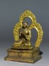 Seated figure of the Buddha with a mandala (side)