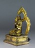 Seated figure of the Buddha with a mandala (side)