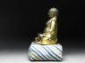 Figure of Hvashang seated on a cushion (side)