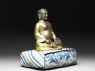 Figure of Hvashang seated on a cushion (side)