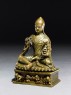 Seated figure of a lama (side)