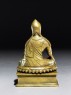 Seated figure of a lama (side)