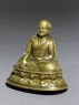 Seated figure of a lama (oblique)