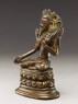 Seated figure of a female deity (side)