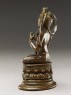 Seated figure of a female deity (side)