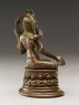 Seated figure of a female deity (side)