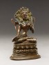 Seated figure of a female deity (side)