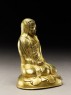 Seated figure of a monk with a robe draped over his head (side)