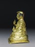 Seated figure of Tashi Lama (side)