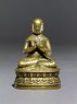 Figure of a seated lama (side)