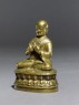 Figure of a seated lama (side)