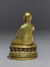 Figure of a seated lama (side)