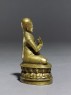 Figure of a seated lama (side)