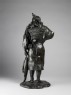 Figure of an Ainu fisherman with his catch (back)