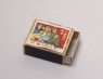 Matchbox depicting figures singing revolutionary songs (oblique)