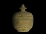 Lidded reliquary containing votive offerings (side)