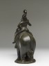 Figure of an elephant and rider from a hanging lamp (side)