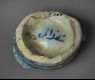 Base fragment of a bowl with rosette (back, oblique)