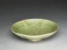 Greenware bowl with ducks amid waves (oblique)