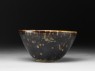 Black ware tea bowl with 'tortoiseshell' glazes (side)