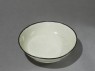 White ware bowl with dragons, flowers, and clouds (oblique)