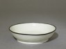 White ware bowl with dragons, flowers, and clouds (oblique)