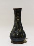 Black ware vase with yellow splashes (side)