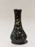 Black ware vase with yellow splashes (oblique)