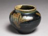 Black ware jar with leaf design (oblique)