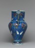 Jug with flowers against a fish-scale background (side)