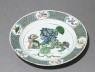 Dish with three lion dogs playing with a ball (oblique)