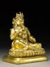 Seated figure of Kubera (side)