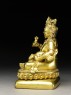 Seated figure of Kubera (side)