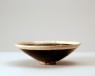 Black ware bowl with white rim (oblique)