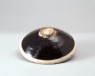 Black ware bowl with white rim (oblique)