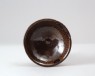 Black ware bowl with 'oil spot' glazes (oblique)