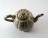 Greenware lobed ewer and lid with floral decoration (oblique)