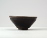 Black ware tea bowl with auspicious inscription (oblique)