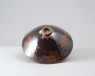 Black ware bowl with russet iron splashes (oblique)