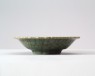 Greenware dish with foliated rim (oblique)