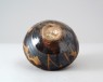 Black ware bowl with brown splashes (oblique)