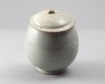 White ware vase and lid with floral decoration (oblique)