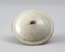 White ware vase and lid with floral decoration (oblique)